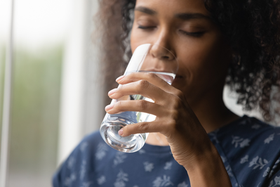 young woman drinking glass of water