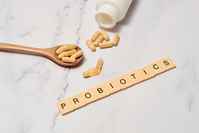 tiles spelling word PROBIOTICS next to probiotic supplements