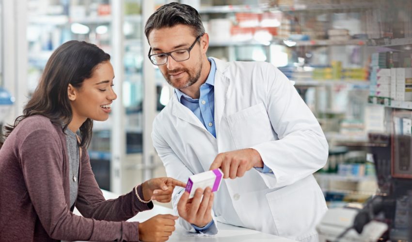 pharmacist talking to patient about medication