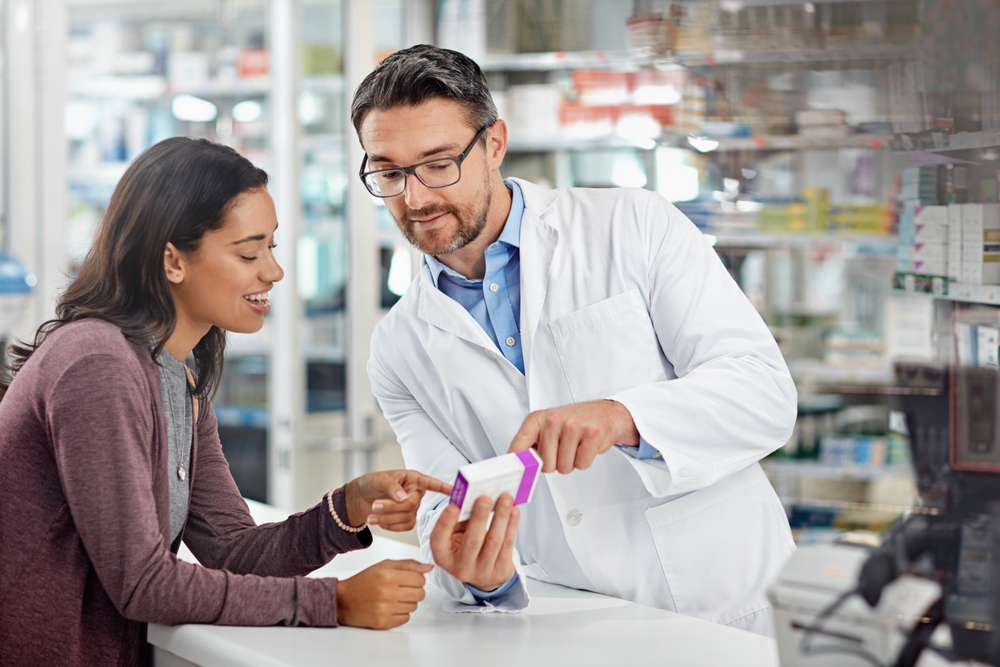 pharmacist talking to patient about medication